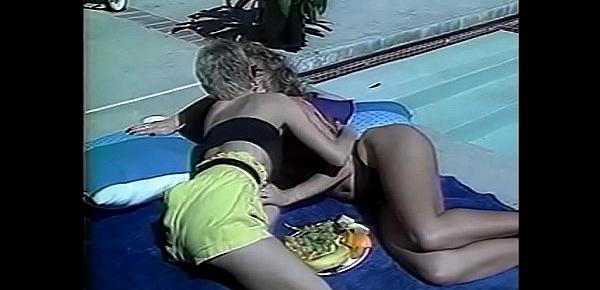  Lesbian sluts gets horny while sunbathing and fuck by the pool